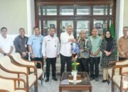Pj Sekdaprov Sumut Terima Laporan Kinerja Komisi Informasi Tahun 2025
